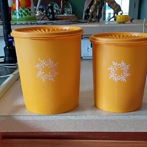 Two Orange Tupperware Nesting Canisters